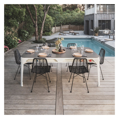 Cornilleau HYPHEN Outdoor Pool Table - White Frame / Dark Grey Cloth. Pictured with the optional table cover on set as an outdoor dining table