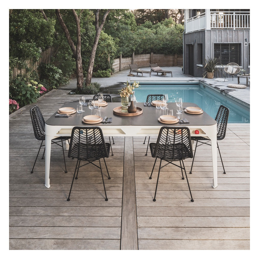 Cornilleau HYPHEN Outdoor Pool Table - White Frame / Light Grey Cloth - Pictured with the optional table cover set as an outdoor dining table by the swimming pool